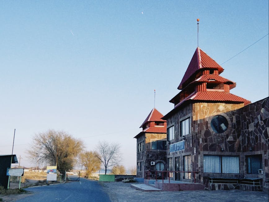Stone building with red roofs in Konaev, Almaty Region, Kazakhstan during the day